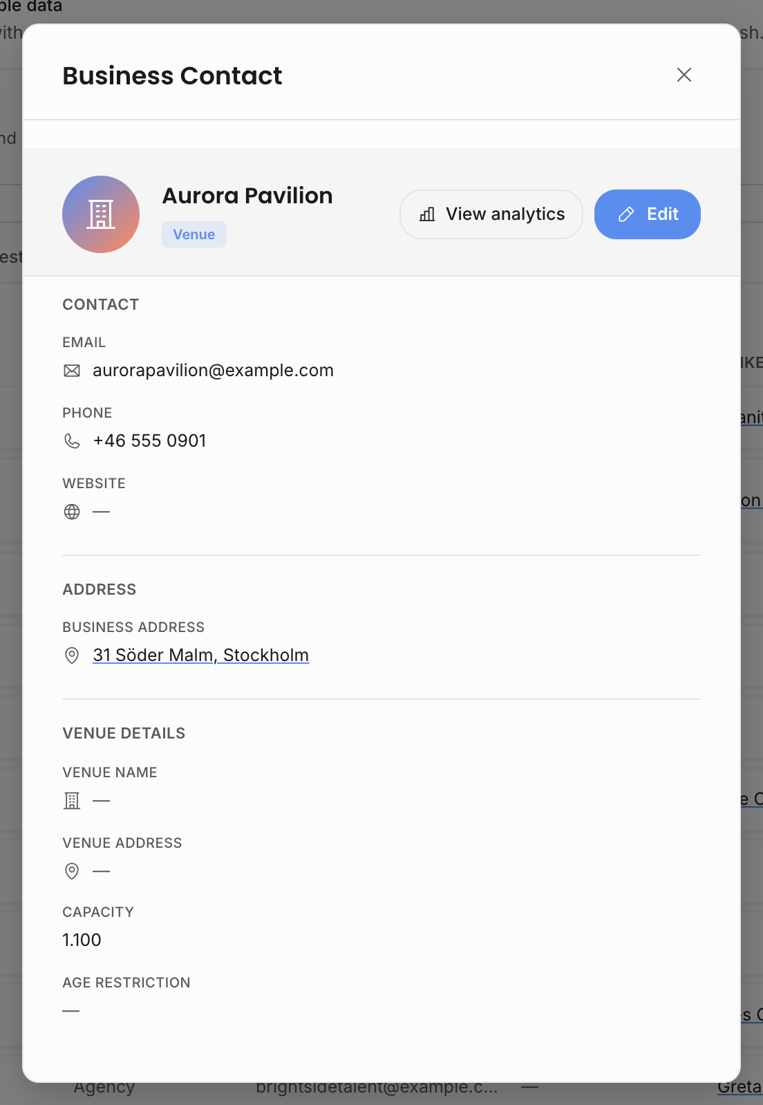 Business contact detail modal showing contact, address, and venue details for a sample venue