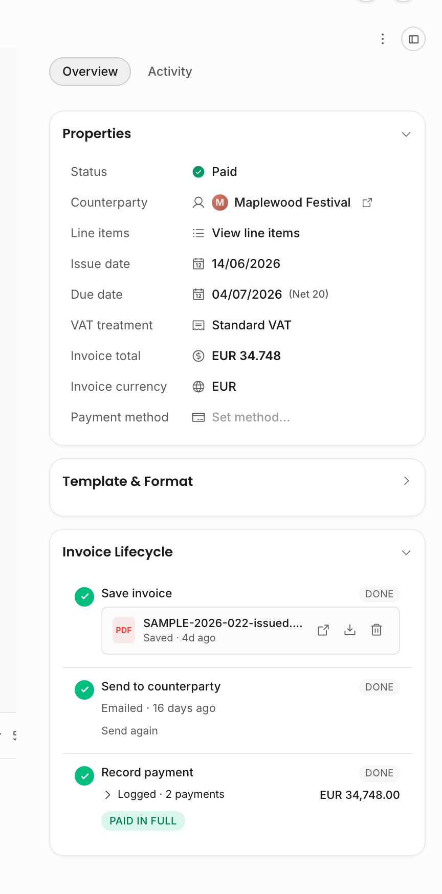 Invoice lifecycle rail showing a paid invoice with two logged payments and Paid in full status