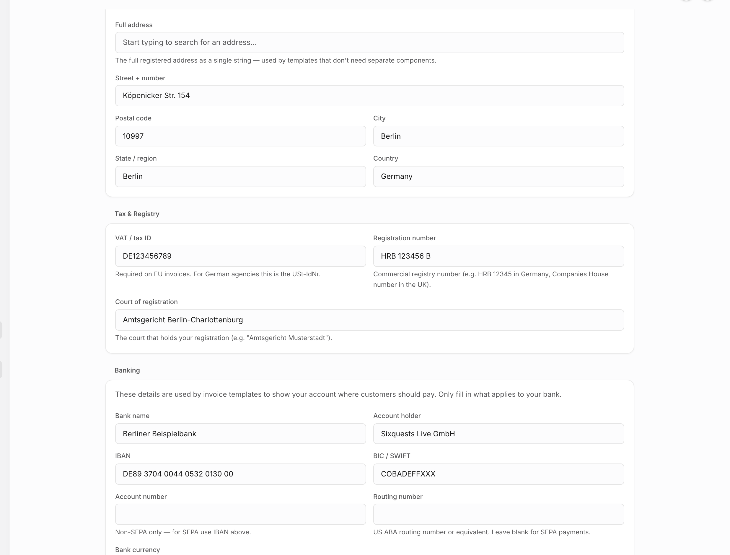 Business details settings with populated registered address, tax, registry, and banking fields