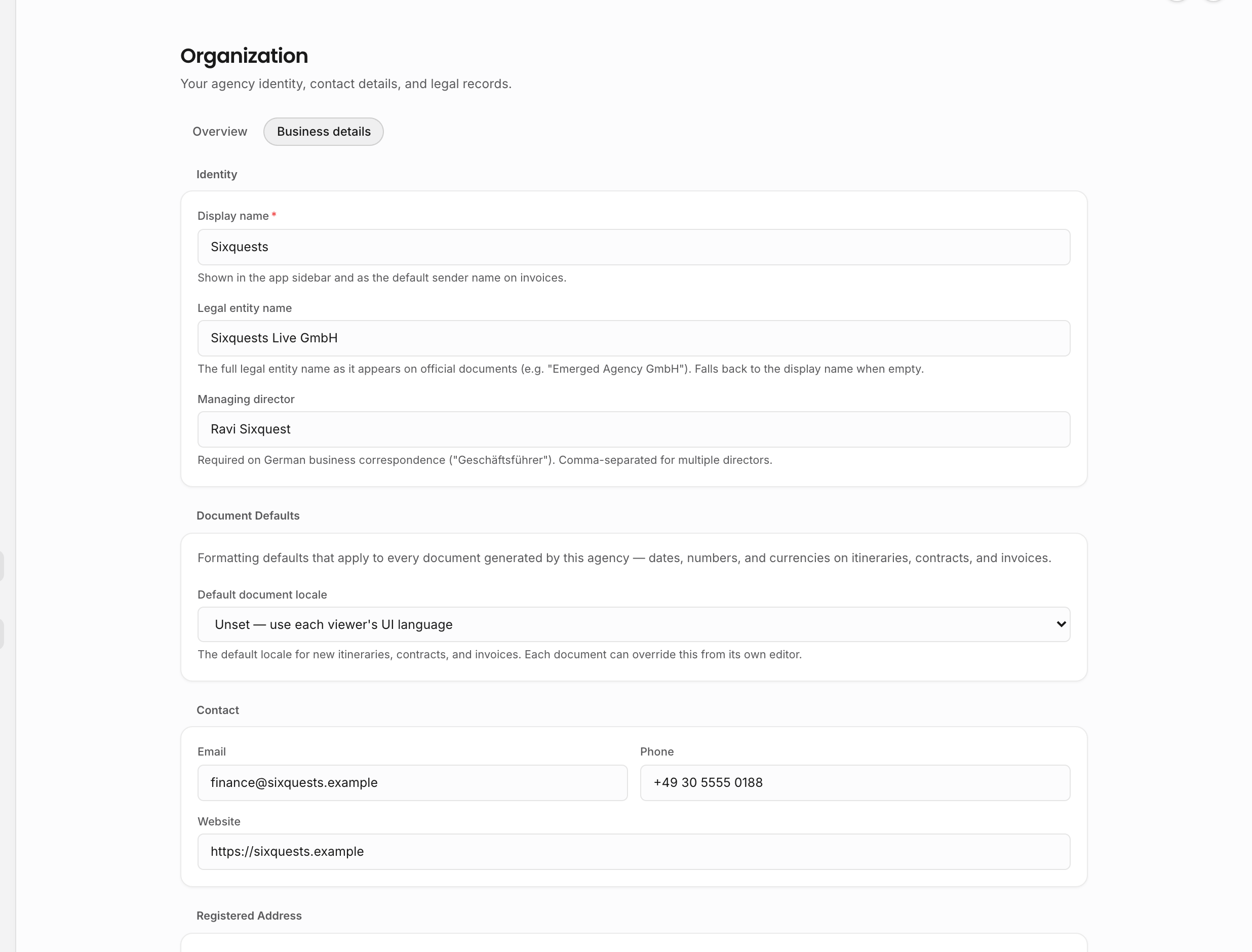Business details settings with populated identity, document defaults, and contact fields